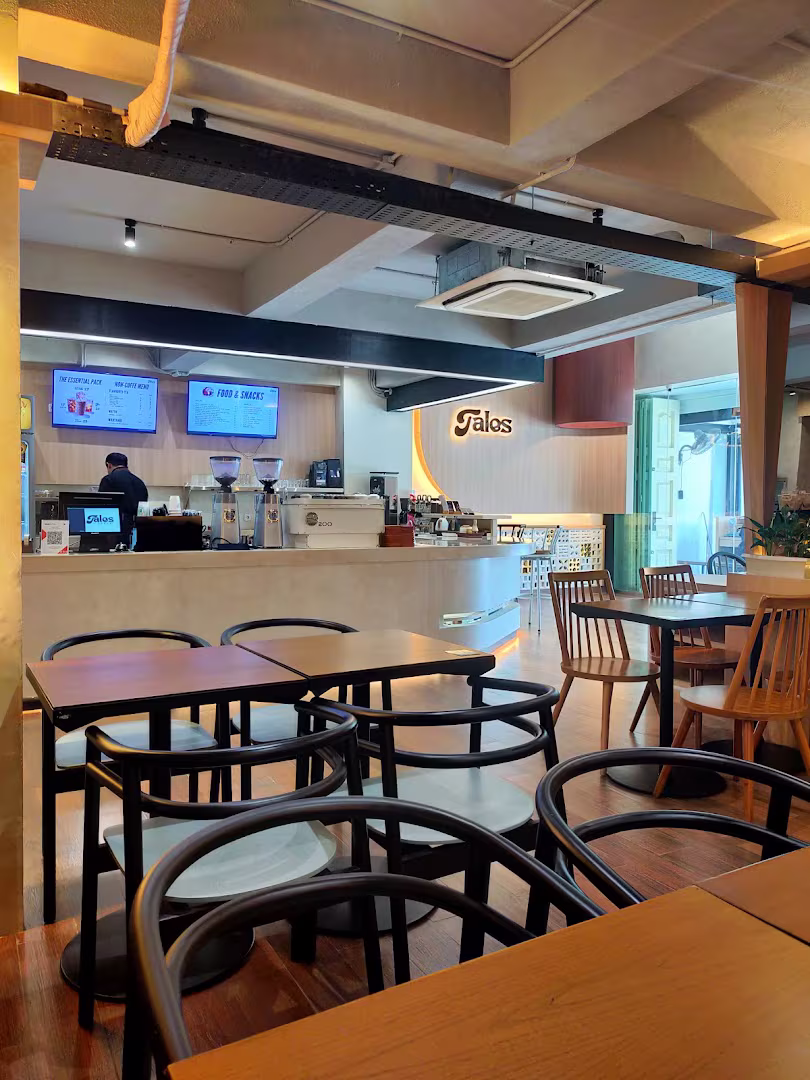 Seating area and barista counter inside Tales Coffee